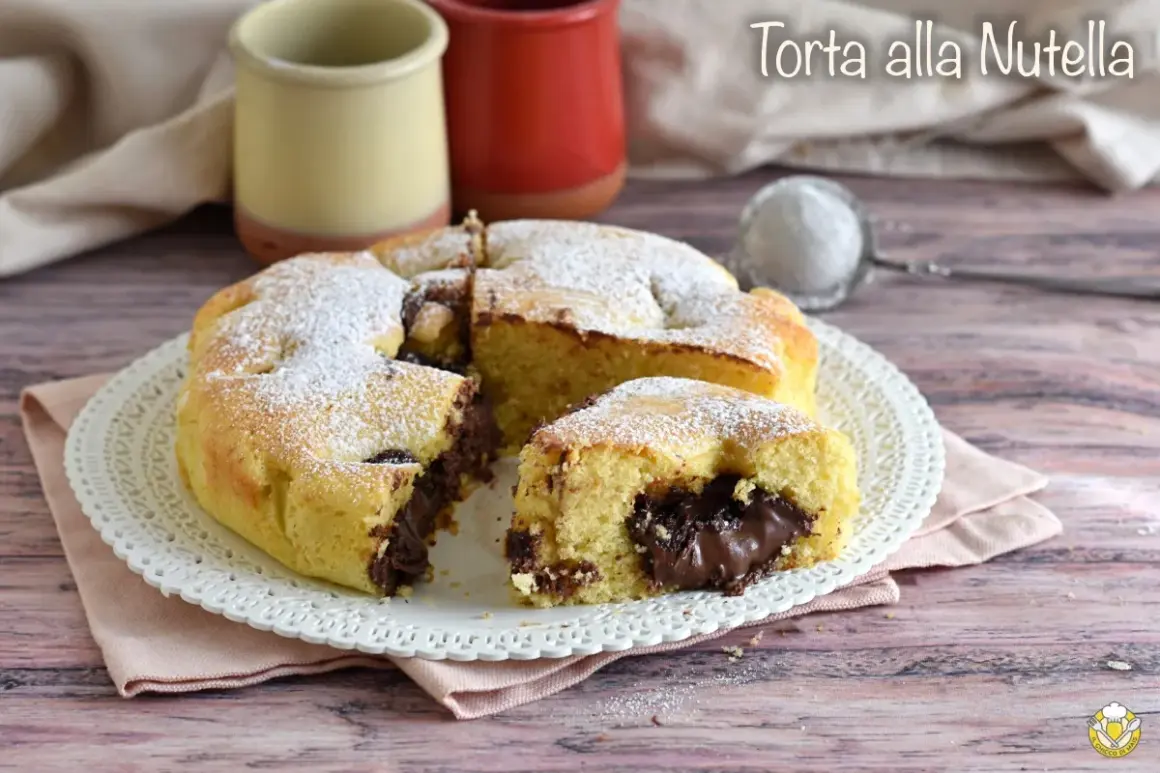 Torta alla Nutella soffice e golosa, con un cuore cremoso di cioccolato. Perfetta per ogni occasione.